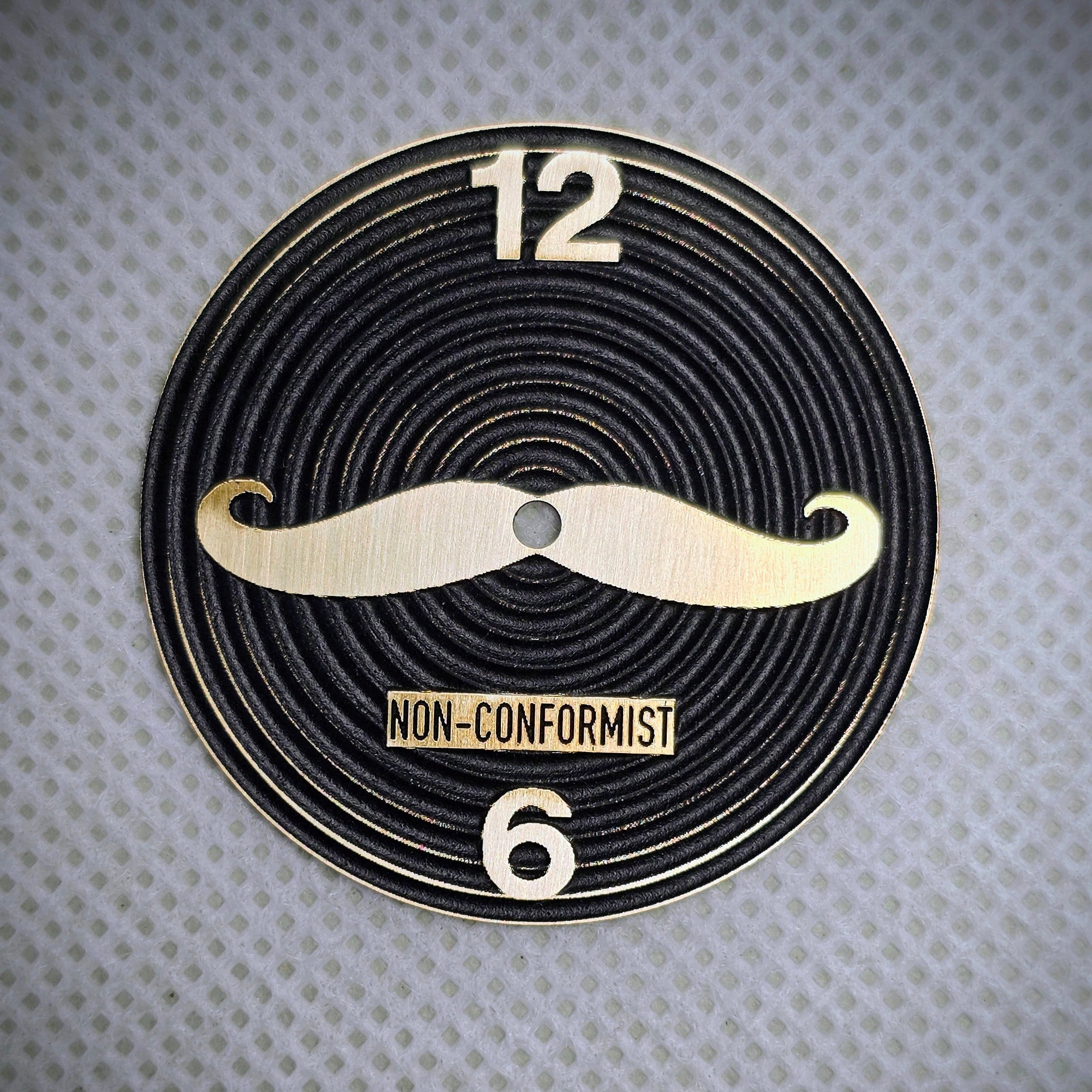 Non Conformist engraved watch dial